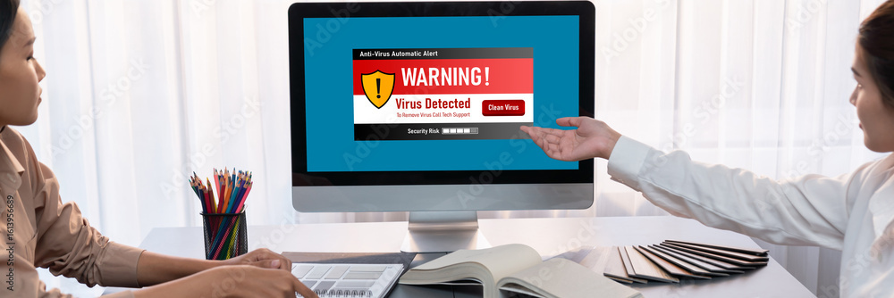 Poster virus warning alert on computer screen detected brisk cyber threat , hacker, computer virus and malw