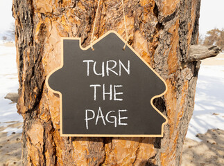 Turn the page symbol. Concept words Turn the page on beautiful blackboard. Beautiful old tree and sand beach background. Business motivational lifestyle turn the page concept. Copy space.
