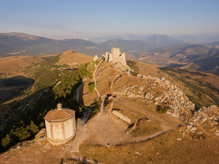 Italy, July 5, 2025: Ruins of Rocca Calascio Castle, an Italian tourist destination and landmark in the Gran Sasso National Park, L'Aquila, Abruzzo. Clear blue skies at sunset.