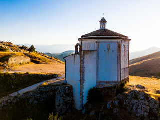 Italy, July 5, 2025: Ruins of Rocca Calascio Castle, an Italian tourist destination and landmark in the Gran Sasso National Park, L'Aquila, Abruzzo. Clear blue skies at sunset.