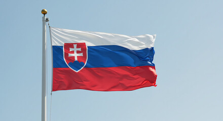 The flag of Slovakia waving steadily in the soft morning breeze, backed by a clean, blue sky.