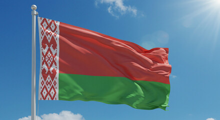 The national flag of Belarus waving gently in the soft morning wind, set against a clear, blue sky.