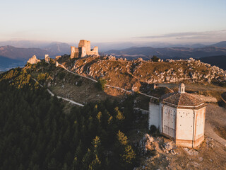 Italy, July 5, 2025: Ruins of Rocca Calascio Castle, an Italian tourist destination and landmark in the Gran Sasso National Park, L'Aquila, Abruzzo. Clear blue skies at sunset.