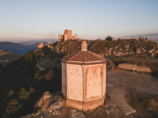 Italy, July 5, 2025: Ruins of Rocca Calascio Castle, an Italian tourist destination and landmark in the Gran Sasso National Park, L'Aquila, Abruzzo. Clear blue skies at sunset.