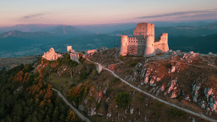 Italy, July 5, 2025: Ruins of Rocca Calascio Castle, an Italian tourist destination and landmark in the Gran Sasso National Park, L'Aquila, Abruzzo. Clear blue skies at sunset.