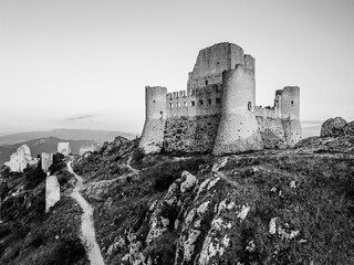 Italy, July 5, 2025: Ruins of Rocca Calascio Castle, an Italian tourist destination and landmark in the Gran Sasso National Park, L'Aquila, Abruzzo. Clear blue skies at sunset.