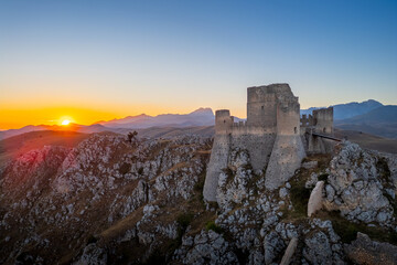 Italy, July 5, 2025: Ruins of Rocca Calascio Castle, an Italian tourist destination and landmark in the Gran Sasso National Park, L'Aquila, Abruzzo. Clear blue skies at sunset.
