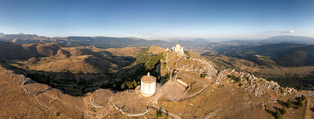 Italy, July 5, 2025: Ruins of Rocca Calascio Castle, an Italian tourist destination and landmark in the Gran Sasso National Park, L'Aquila, Abruzzo. Clear blue skies at sunset.