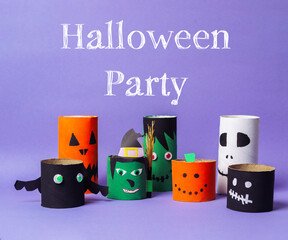 Colorful Halloween party decorations made from paper rolls with playful designs and vibrant colors