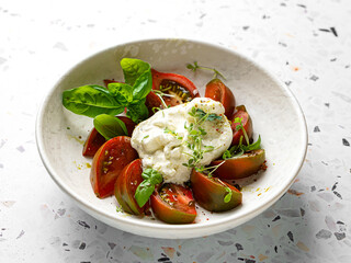 burrata with tomatoes, basil and pesto
