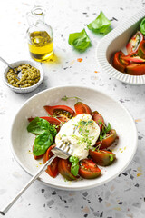 burrata with tomatoes, basil and pesto