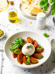 burrata with tomatoes, basil and pesto