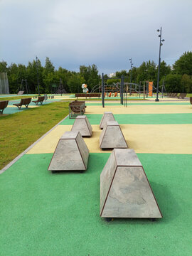 Outdoor playground in a public park with parkour pedestals