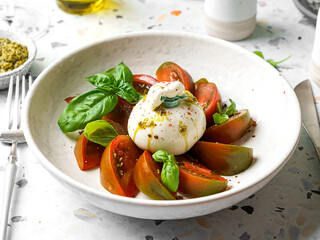 burrata with tomatoes, basil and pesto