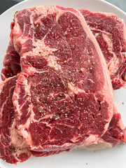 Overhead View of Ribeye Pair on White Dish