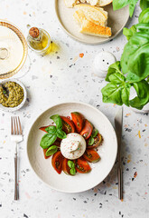 burrata with tomatoes, basil and pesto