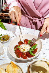 burrata with tomatoes, basil and pesto
