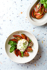 burrata with tomatoes, basil and pesto
