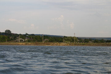 A body of water with a bridge in the background © parpalac