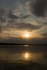 A body of water with a sunset