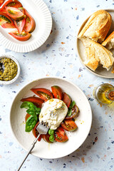 burrata with tomatoes, basil and pesto