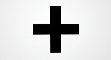 Obraz premium Bold and minimalistic black cross graphic on a clean white backdrop, representing addition and