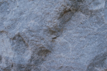 Close-up of grey stone surface texture, natural rock background