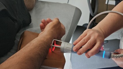 Medical professional conducts examination using advanced device on patient arm