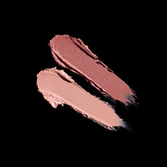 set of two pink lipstick smears, cosmetics beauty product texture, lipstick swatch on the black background
