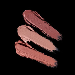 set of three pink lipstick smears, cosmetics beauty product texture, lipstick swatch on the black background