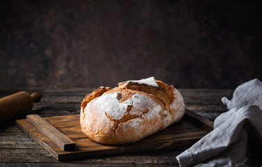 Fresh homemade crisp bread on wooden background. French bread. Bread at leaven. Unleavened bread