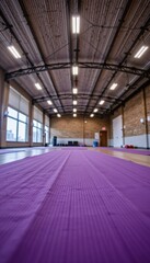 tilt up shot from yoga mat to gym ceiling lights, creating dynamic motion feeling