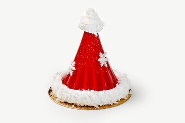 Red santa claus hat cake decorated with snowflakes and white icing on white background