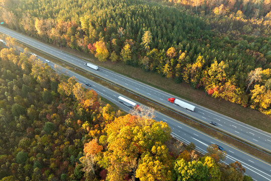 Fototapeta Highway road in North Carolina Appalachian mountains in fall season. Expressway lanes for fast passing of car traffic