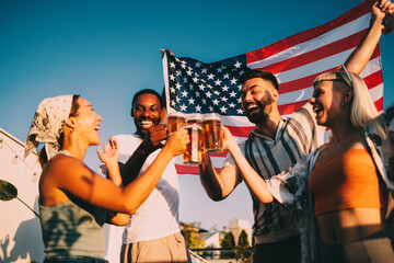 Friends toasting with beer celebrating with american flag