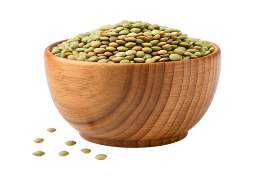 Rich green lentils overflowing from a rustic wooden bowl, a wholesome pantry staple for healthy eating and culinary inspiration.