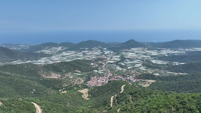 Aerial View of Farmland Patches and Greek Village by the Aegean Coast