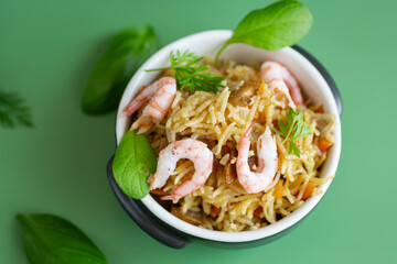 Delicious lunch with shrimps, rice and green accent