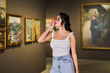 women in the museum looks at art exhibitions gallery