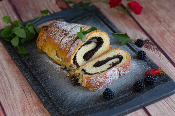 Sweet roll with poppy seeds and berries for tea