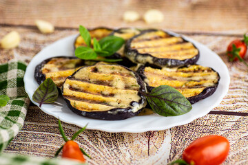 Homemade eggplant appetizer with garlic, herbs and cheese