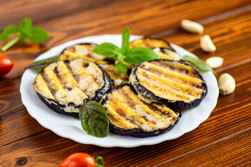 Baked eggplants with fried stripes and a delicate sauce