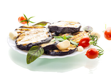 Golden eggplant slices with basil are ideal for dinner