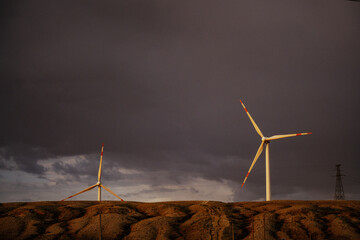 wind turbines at sunset