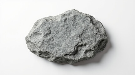 Obraz premium Textured gray granite stone with rough edges isolated on white background showing natural rugged surface and irregular shape