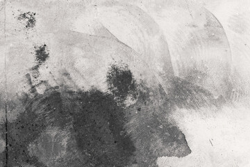 Black and white grunge concrete texture with brush marks for urban background and abstract surface...