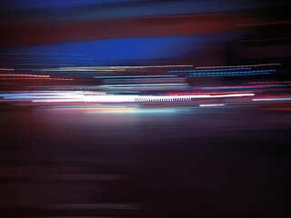 Selective focus photography. A frame in motion. Abstract background. Colorful image. Long shutter speed. Light streaks. Movement of transportation. Shooting from transportation. Blurred image