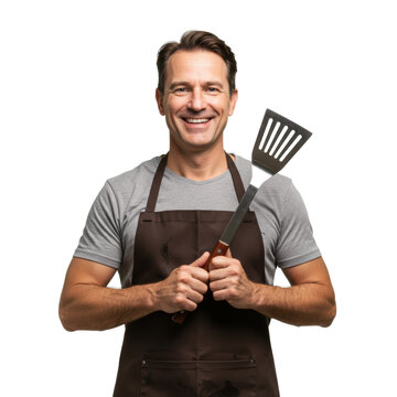 A happy chef is holding a spatula, ready to grill some delicious food.