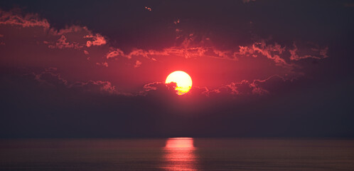 Beautiful sunrise with sun track on ocean