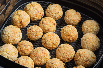 Baked crispy tuna potato croquettes with breadcrumb coating in air fryer.